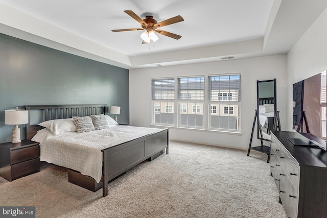 11972 Tygart Lake Dr, Bristow, VA 20136 - bedroom featuring carpet floors, ceiling fan, and a raised ceiling