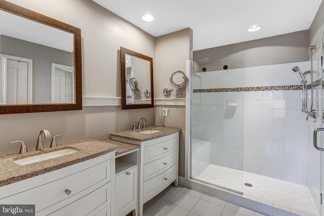 11972 Tygart Lake Dr, Bristow, VA 20136 - bathroom featuring a shower stall, two vanities, and tile patterned floors