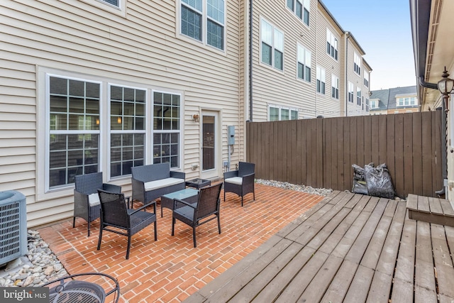 11972 Tygart Lake Dr, Bristow, VA 20136 - deck with a patio area and an outdoor hangout area