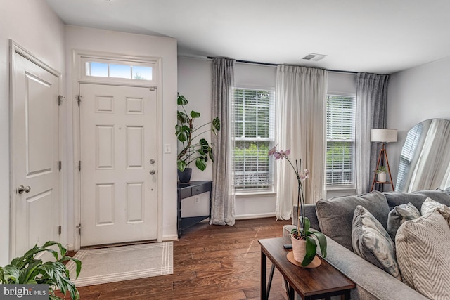 11972 Tygart Lake Dr, Bristow, VA 20136 - living area with plenty of natural light and dark wood-style flooring