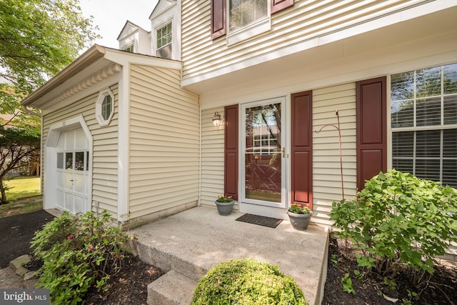 doorway to property with an attached garage