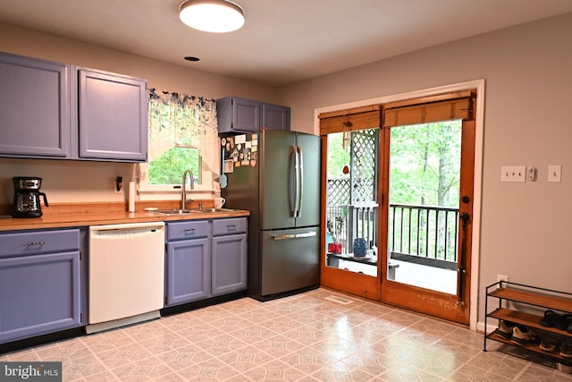 359 Old Linden Rd, Linden, VA 22642 - kitchen with white dishwasher, freestanding refrigerator, a sink, gray cabinetry, and light flooring