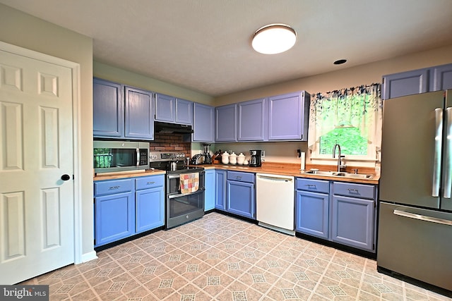359 Old Linden Rd, Linden, VA 22642 - kitchen featuring stainless steel appliances, a sink, butcher block counters, under cabinet range hood, and blue cabinetry