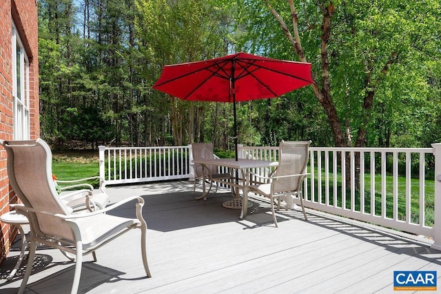 wooden terrace featuring outdoor dining area