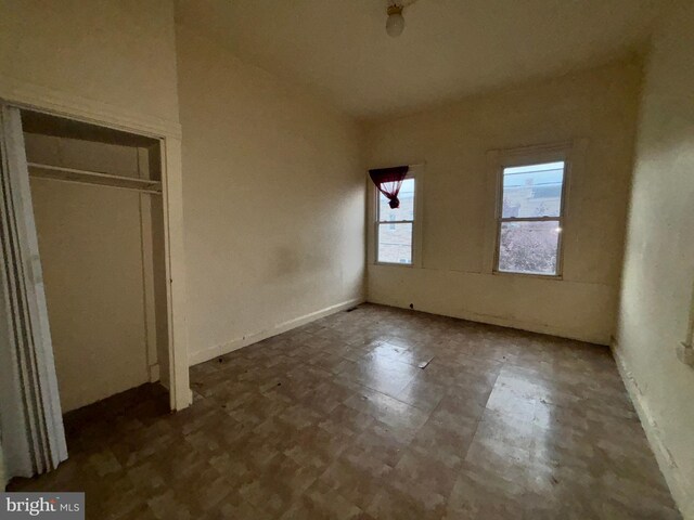 unfurnished bedroom with a closet and tile patterned floors