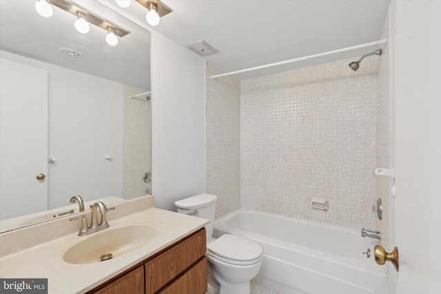 bathroom with bathing tub / shower combination, toilet, visible vents, and vanity