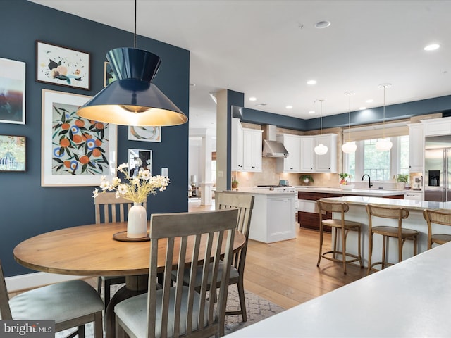 14484 Bluff Point Ct, Gainesville, VA 20155 - dining area featuring light wood-style flooring and recessed lighting