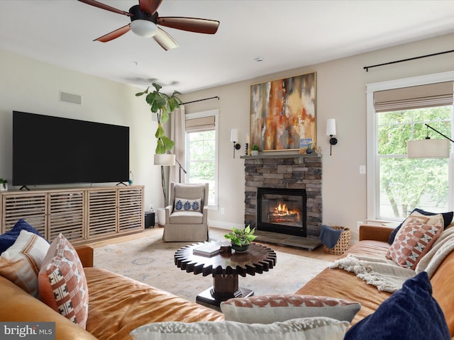 14484 Bluff Point Ct, Gainesville, VA 20155 - living room featuring a fireplace, ceiling fan, and wood finished floors