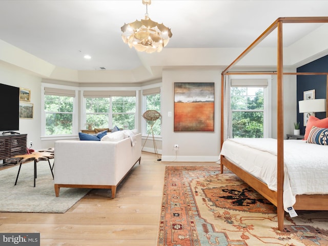 14484 Bluff Point Ct, Gainesville, VA 20155 - bedroom with a chandelier, multiple windows, light wood-type flooring, and recessed lighting