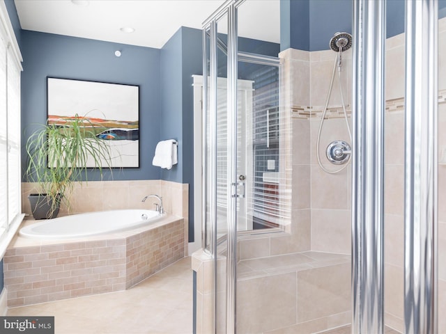 14484 Bluff Point Ct, Gainesville, VA 20155 - bathroom with a shower stall, a bath, and tile patterned flooring