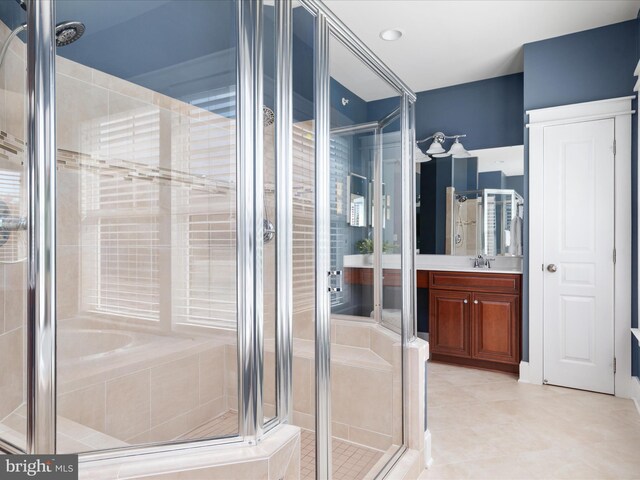 14484 Bluff Point Ct, Gainesville, VA 20155 - full bathroom with tile patterned floors, a stall shower, and vanity