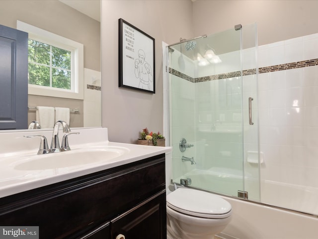 14484 Bluff Point Ct, Gainesville, VA 20155 - bathroom featuring toilet, vanity, and combined bath / shower with glass door