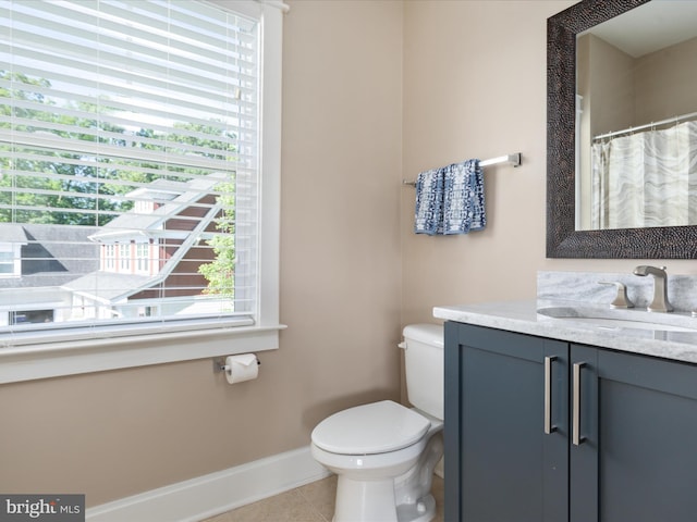 14484 Bluff Point Ct, Gainesville, VA 20155 - full bathroom with vanity, baseboards, toilet, and tile patterned flooring