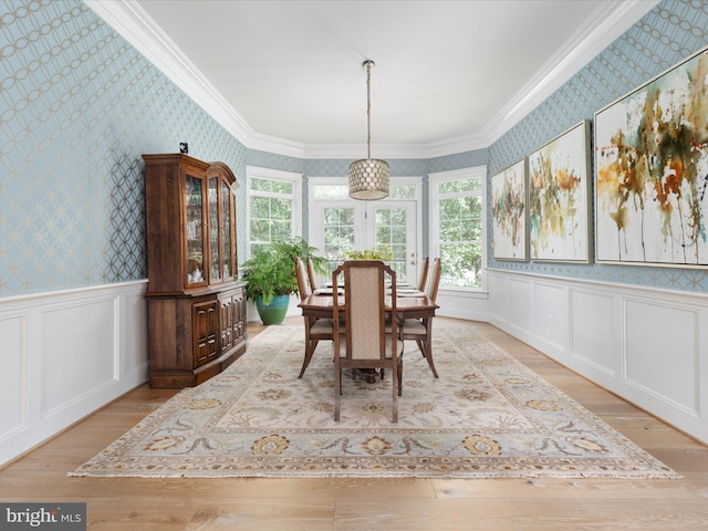 14484 Bluff Point Ct, Gainesville, VA 20155 - dining area featuring wallpapered walls, hardwood / wood-style floors, ornamental molding, and wainscoting