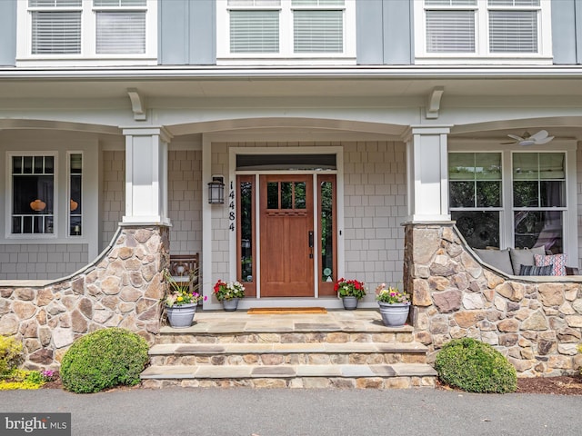 14484 Bluff Point Ct, Gainesville, VA 20155 - view of exterior entry featuring a porch and stone siding