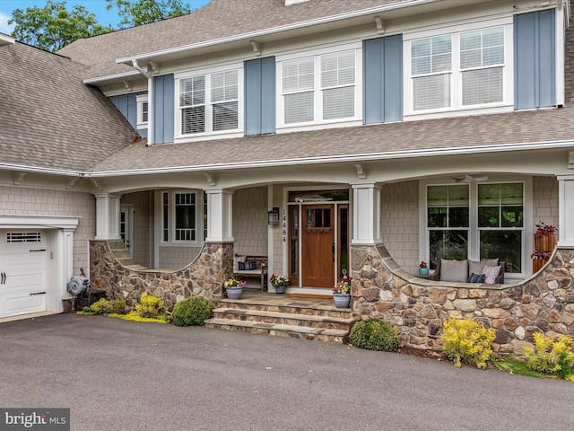 14484 Bluff Point Ct, Gainesville, VA 20155 - view of front facade with a porch, stone siding, and roof with shingles