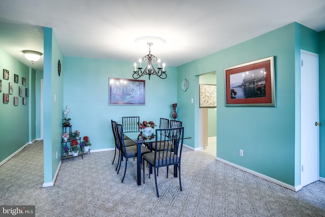 5101 River Rd Unit 811, Bethesda, MD 20816 - dining space featuring carpet floors, a chandelier, and baseboards
