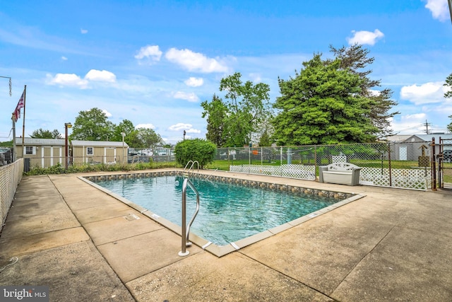 view of pool with fence, a fenced in pool, and a patio area