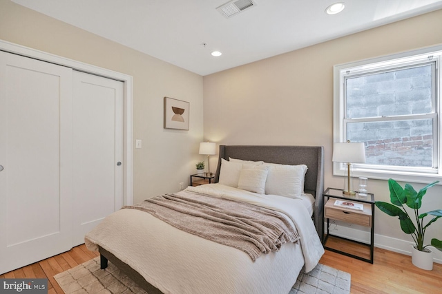2515 17th St NW Unit 5, Washington, DC 20009 - bedroom with light wood-style floors, recessed lighting, a closet, and baseboards