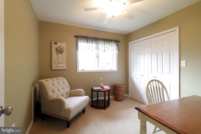 carpeted office space with ceiling fan