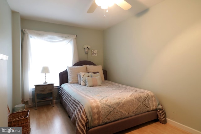 bedroom featuring ceiling fan and wood finished floors