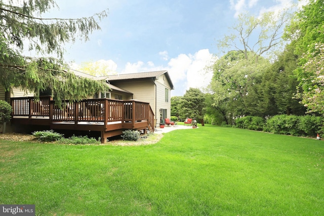 view of yard featuring a wooden deck