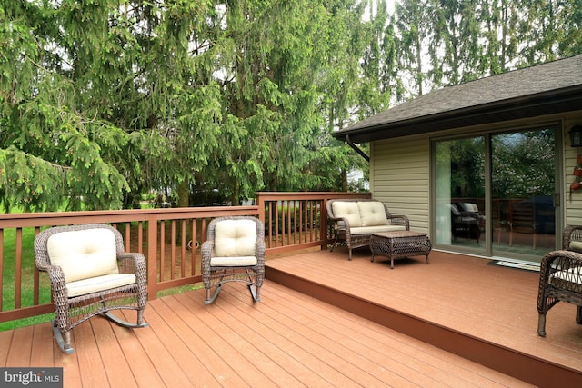 wooden terrace featuring an outdoor hangout area