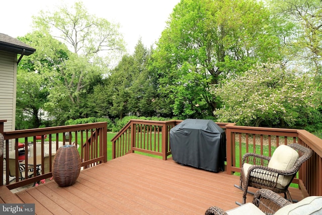 wooden deck featuring area for grilling