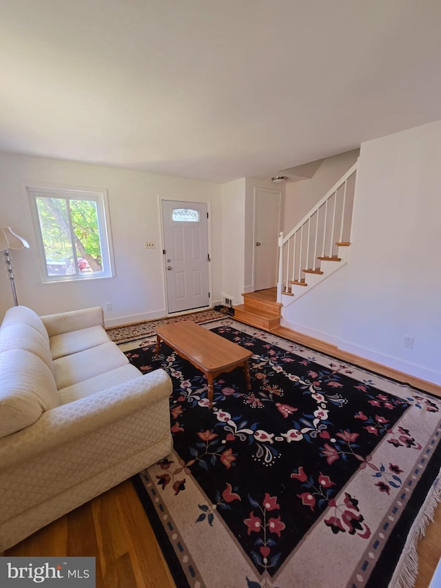 105 S Iris St, Alexandria, VA 22304 - living area featuring stairs, wood finished floors, and baseboards