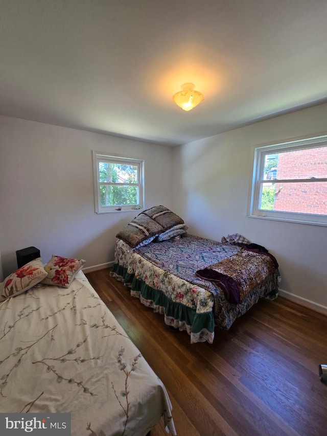 105 S Iris St, Alexandria, VA 22304 - bedroom with multiple windows, wood finished floors, and baseboards