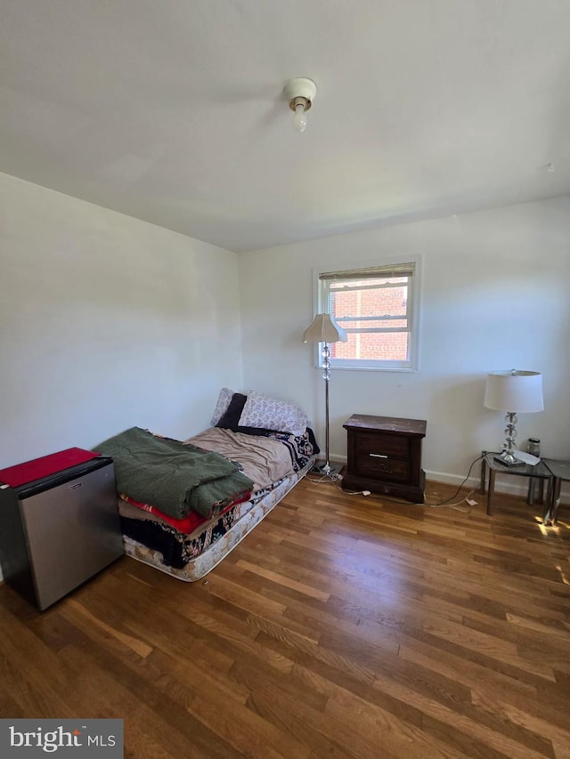 105 S Iris St, Alexandria, VA 22304 - bedroom featuring stainless steel refrigerator, wood finished floors, and baseboards