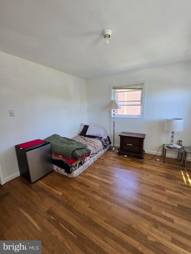 105 S Iris St, Alexandria, VA 22304 - bedroom with wood finished floors, fridge, and baseboards