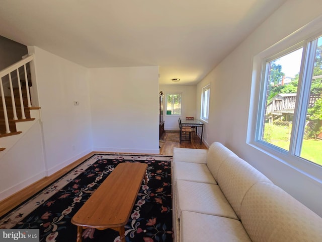 105 S Iris St, Alexandria, VA 22304 - living area with wood finished floors, stairs, and baseboards