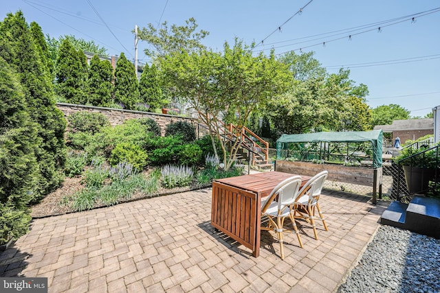 236 Nicholson St NE, Washington, DC 20011 - view of patio with fence, outdoor dining space, and stairs