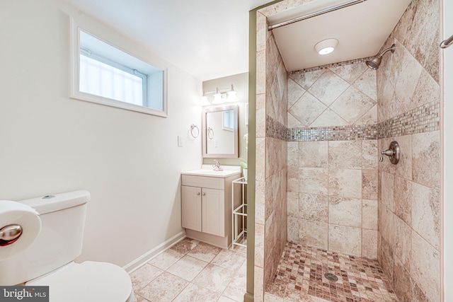 236 Nicholson St NE, Washington, DC 20011 - full bath with toilet, a tile shower, tile patterned floors, baseboards, and vanity