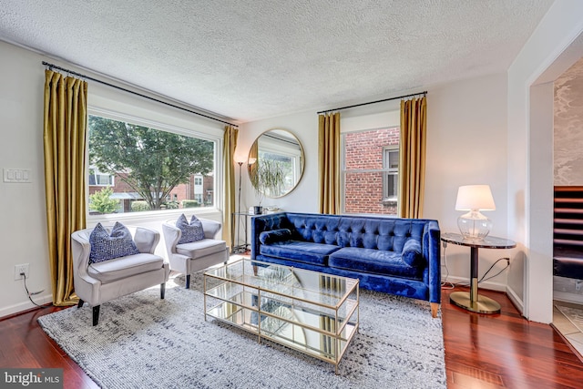 236 Nicholson St NE, Washington, DC 20011 - living area featuring baseboards, a textured ceiling, and wood finished floors