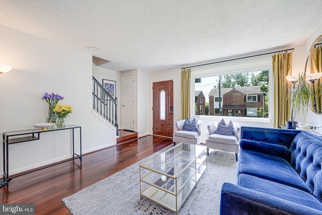 236 Nicholson St NE, Washington, DC 20011 - living room with stairway, a textured ceiling, baseboards, and wood finished floors