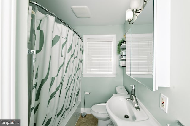 208 Veterans Ave, West Berlin, NJ 08091 - bathroom featuring a sink, toilet, tile patterned floors, baseboards, and shower / bath combo with shower curtain