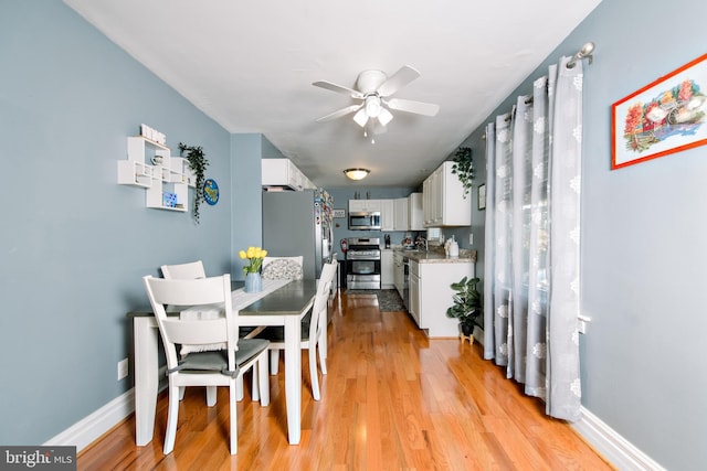 208 Veterans Ave, West Berlin, NJ 08091 - dining space featuring a ceiling fan, light wood-type flooring, and baseboards