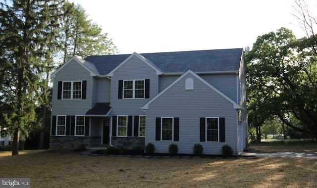 view of front of property featuring stone siding