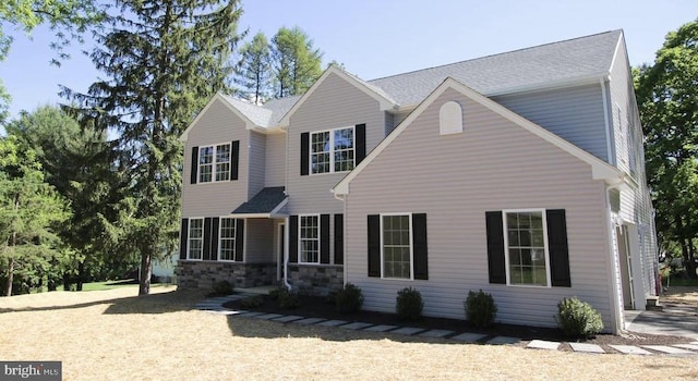 view of front of home featuring stone siding