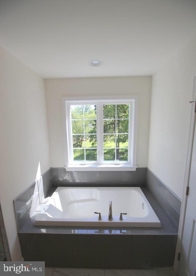 bathroom featuring a garden tub