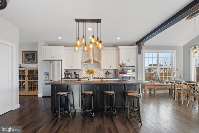 33 Docwill Dr, Barto, PA 19504 - kitchen with a breakfast bar, wall chimney exhaust hood, stainless steel appliances, white cabinets, and a spacious island