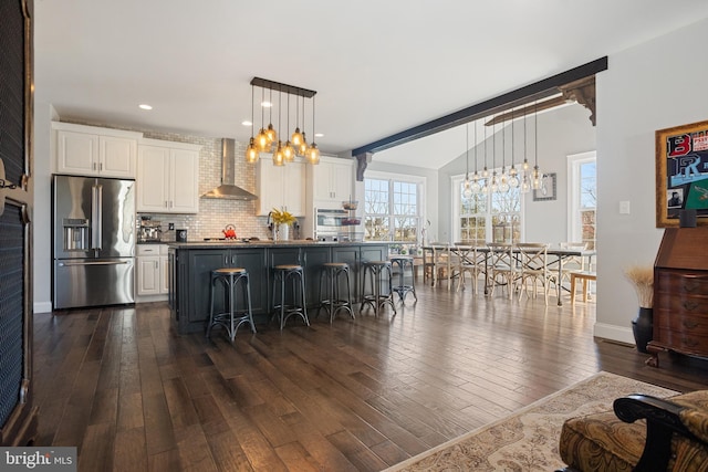 33 Docwill Dr, Barto, PA 19504 - kitchen featuring white cabinetry, stainless steel appliances, dark wood finished floors, and wall chimney exhaust hood