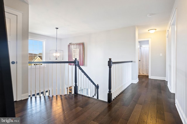 33 Docwill Dr, Barto, PA 19504 - corridor with an inviting chandelier, hardwood / wood-style flooring, baseboards, and an upstairs landing