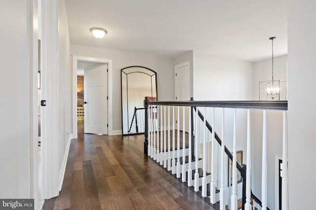 33 Docwill Dr, Barto, PA 19504 - corridor with baseboards, an upstairs landing, dark wood finished floors, and a chandelier