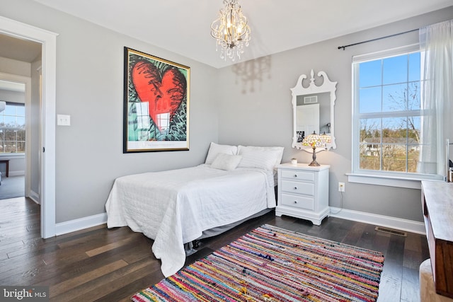 33 Docwill Dr, Barto, PA 19504 - bedroom featuring dark wood-style flooring, a notable chandelier, baseboards, and visible vents