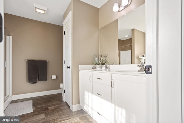 33 Docwill Dr, Barto, PA 19504 - full bathroom with a stall shower, toilet, a sink, and wood finished floors