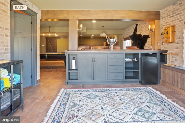 33 Docwill Dr, Barto, PA 19504 - kitchen with brick wall, light tile patterned flooring, open shelves, and pendant lighting
