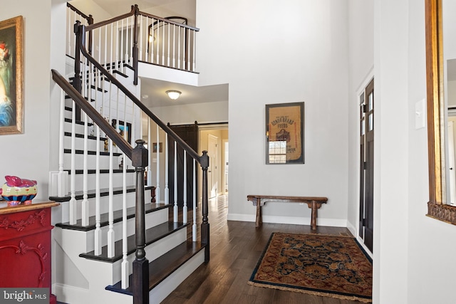 33 Docwill Dr, Barto, PA 19504 - entrance foyer with baseboards, stairway, dark wood finished floors, and a high ceiling